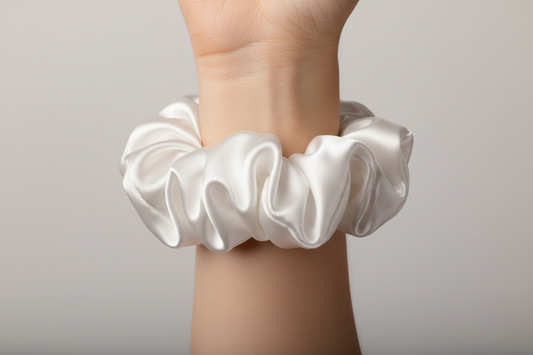 white satin scrunchie on arm