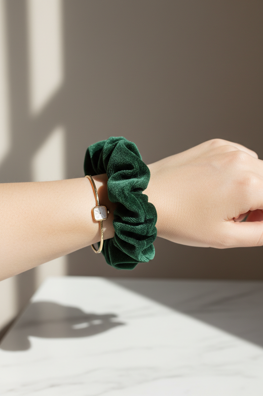 Green velvet scrunchie on arm